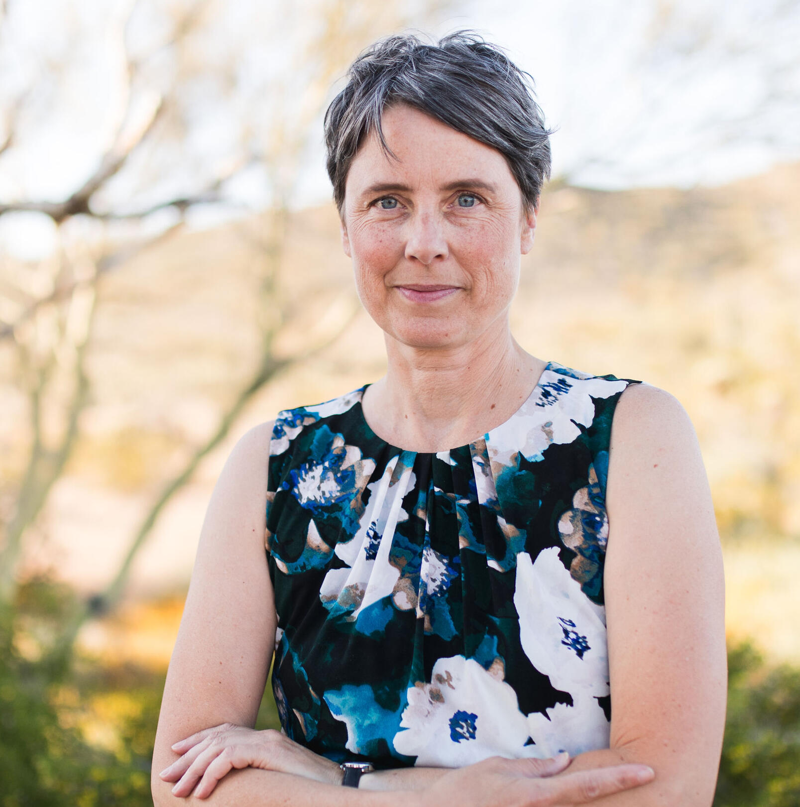 Image of proprietor standing in desert ecosystem